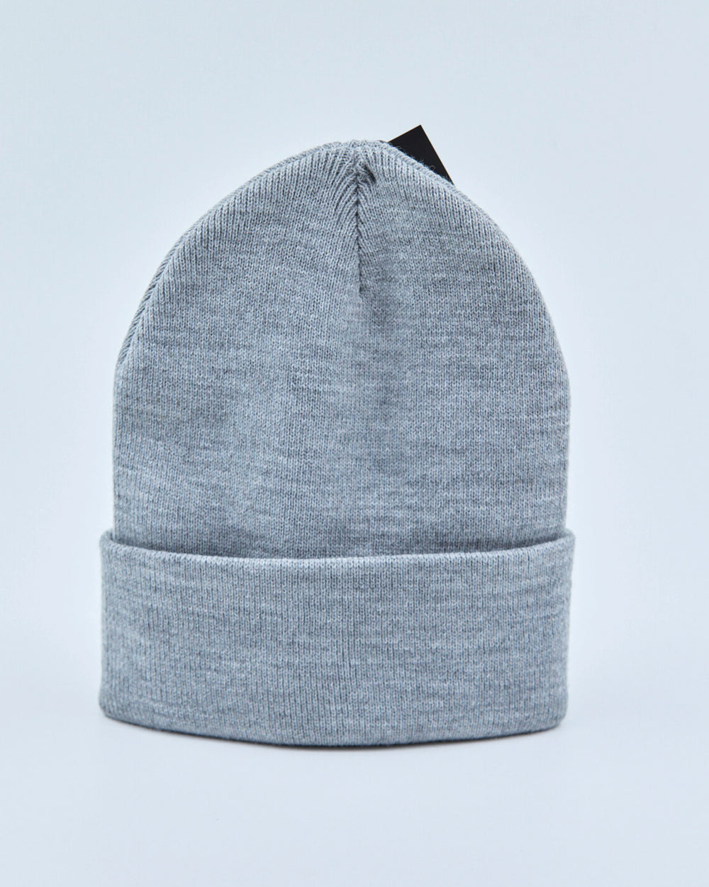 Light gray beanie on a light blue background