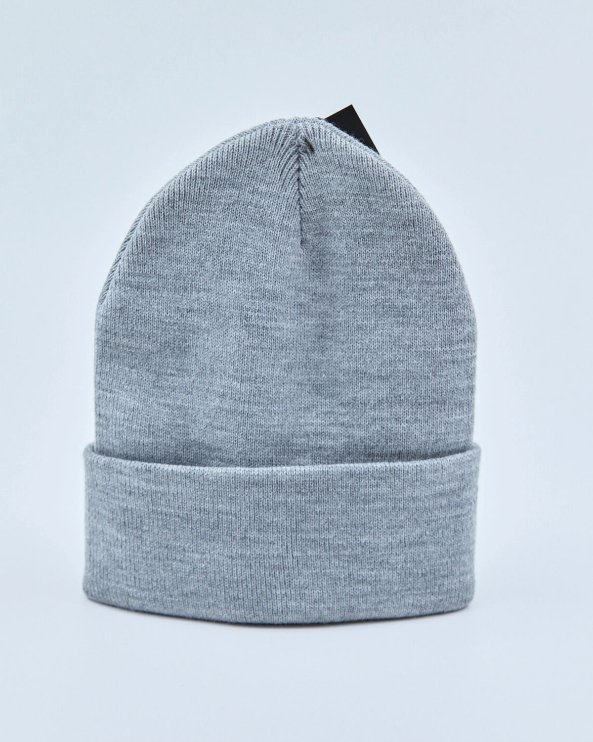 Light gray beanie on a light blue background