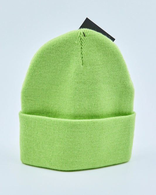 Light lime green beanie on a light gray background