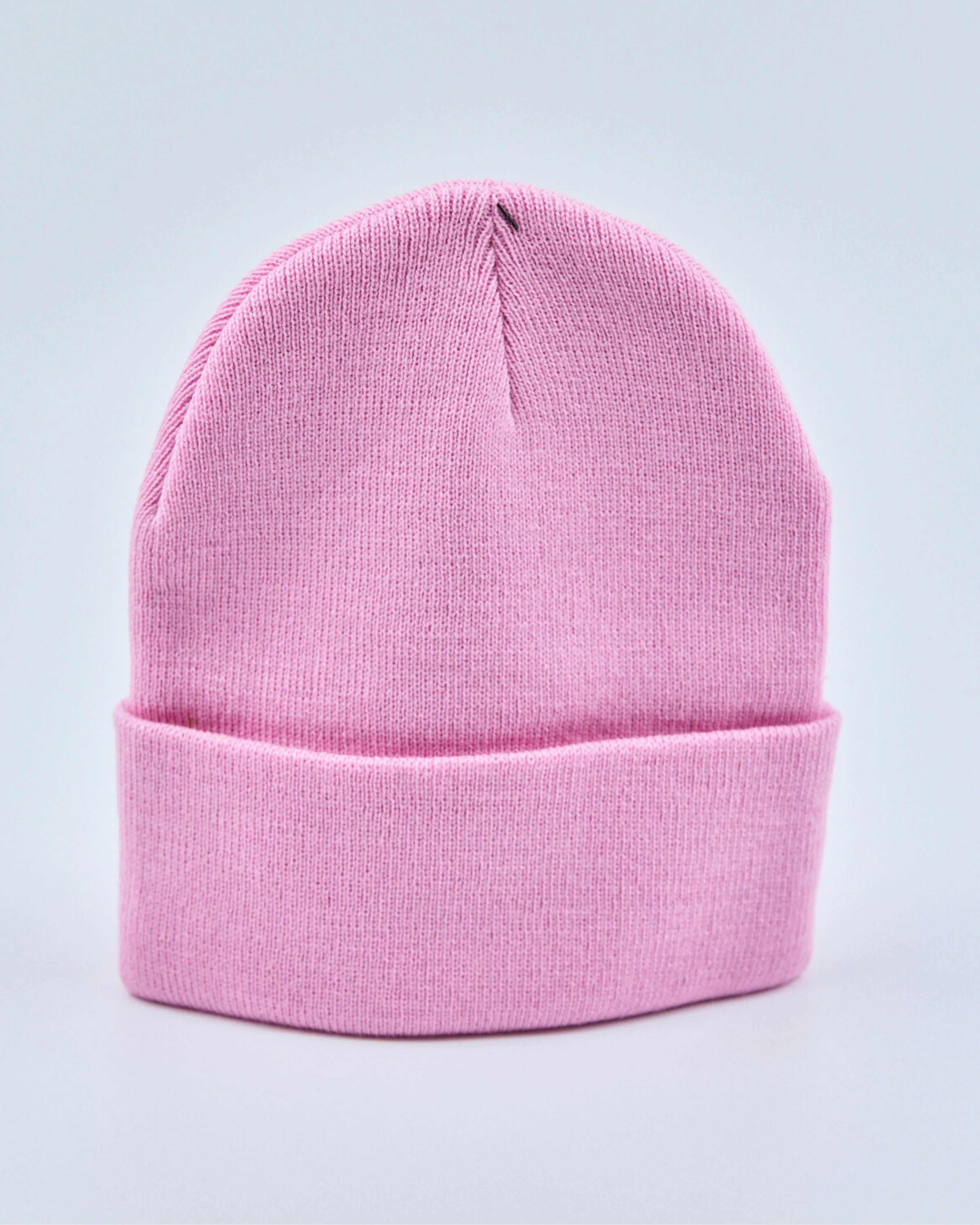 Light pink beanie on a light gray background