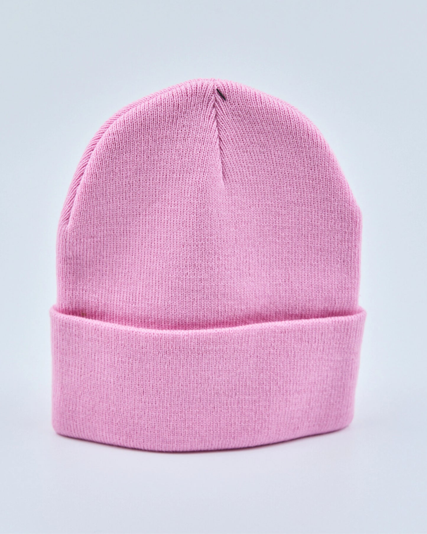 Light pink beanie on a light gray background