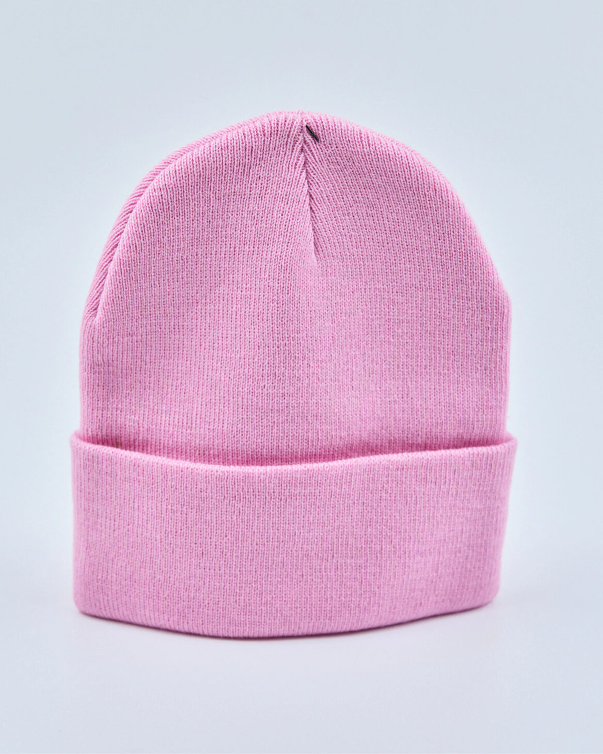 Light pink beanie on a light gray background