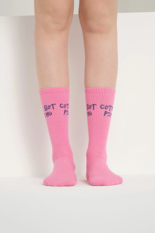 front view of pink cute but psycho socks