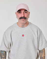 front view of man wearing Cute But Psycho Light Pink Washed Cap