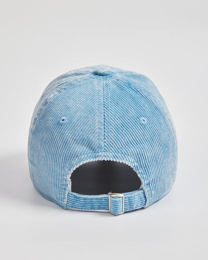 Blue distressed baseball cap on a light gray background