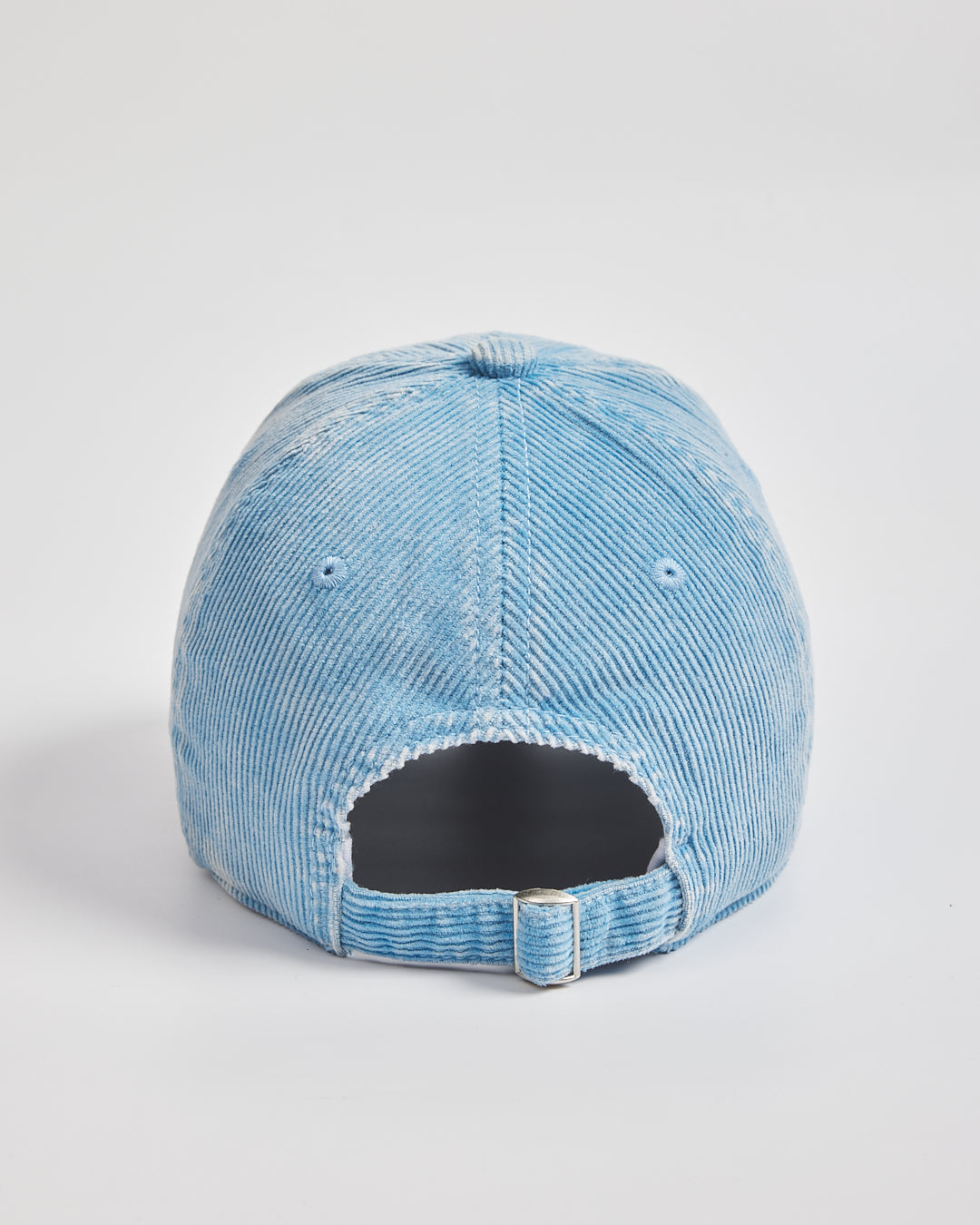 Blue cap on a light gray background