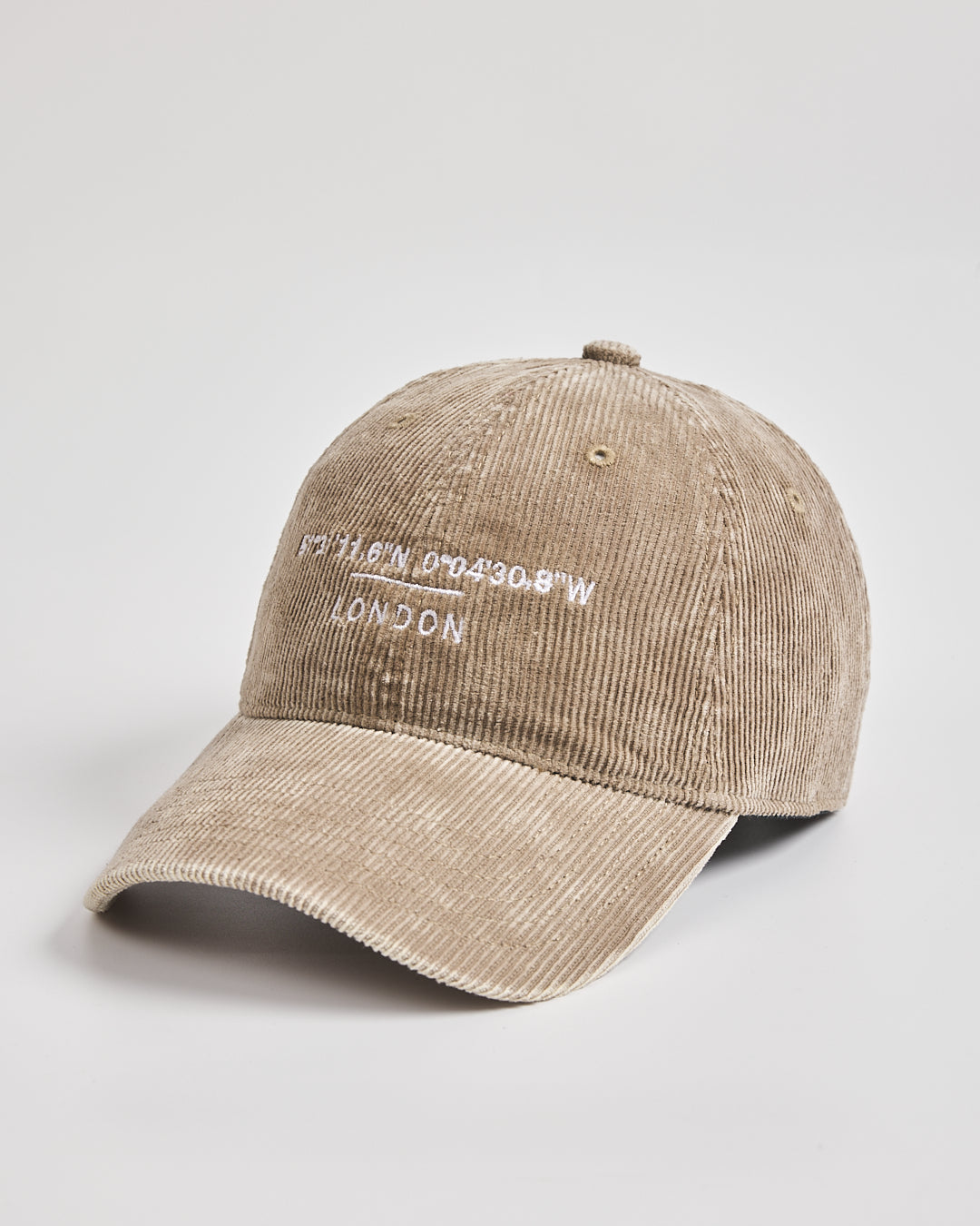 Beige cap with text on a light gray background