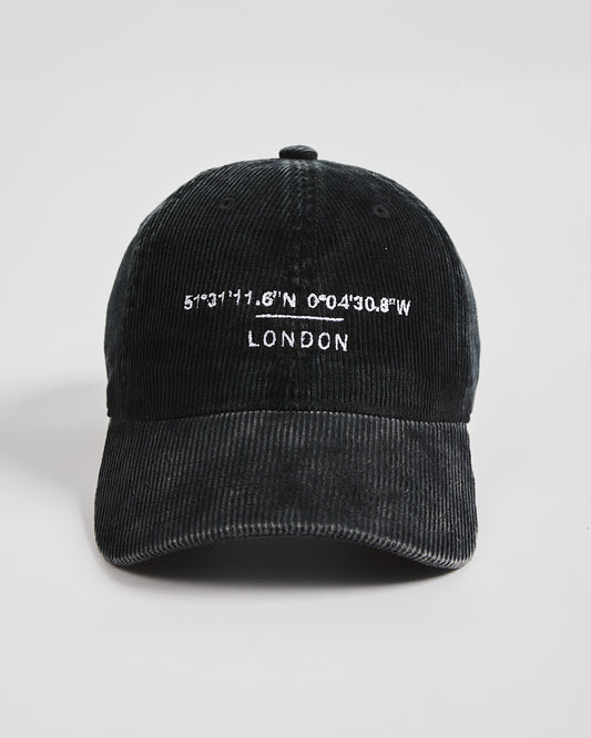 Black cap with white text on a light gray background