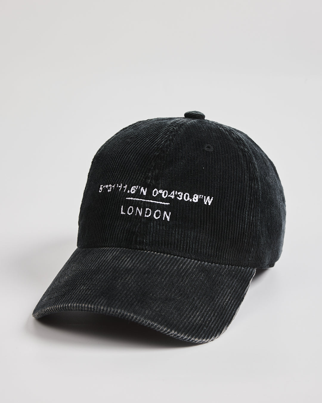 Black cap with white text on a light gray background