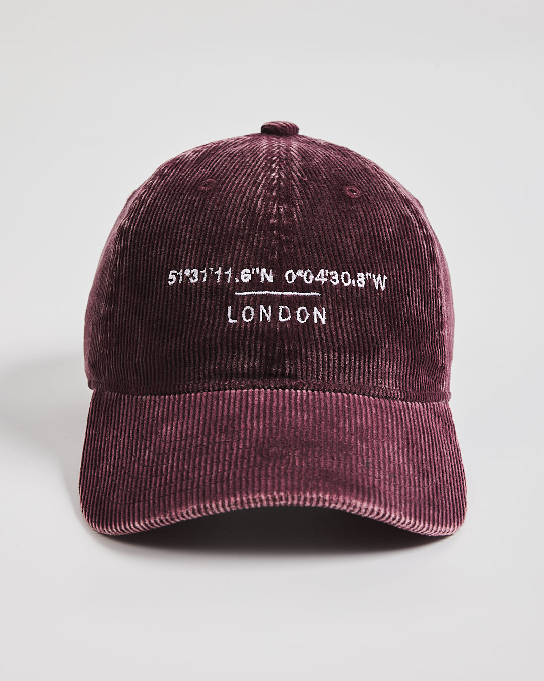 Maroon cap with white text on a light gray background