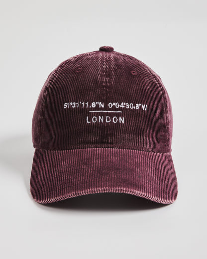 Maroon cap with white text on a light gray background