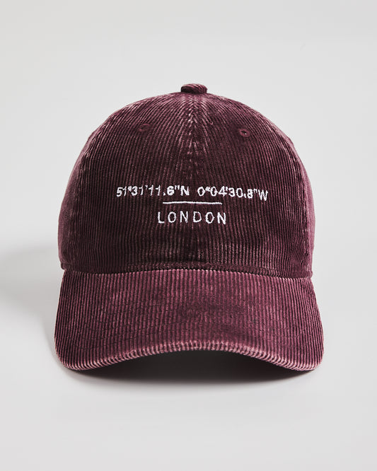Maroon cap with white text on a light gray background