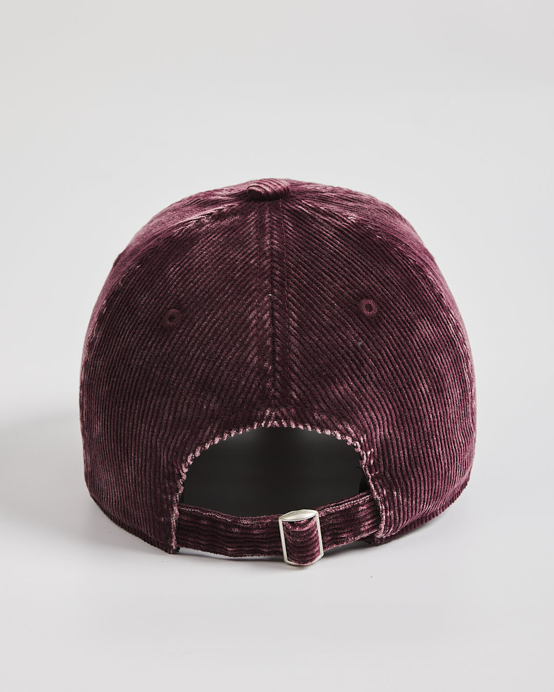 Purple velvet baseball cap on a light gray background