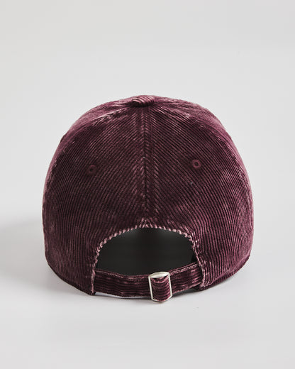 Purple velvet baseball cap on a light gray background