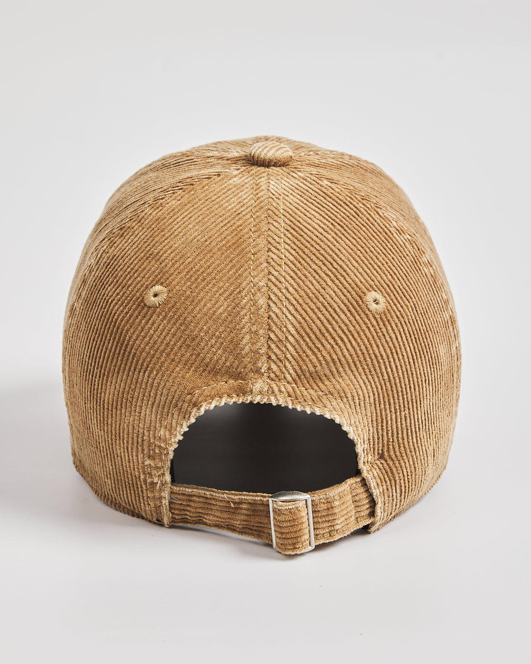 Camel corduroy cap on a light gray background