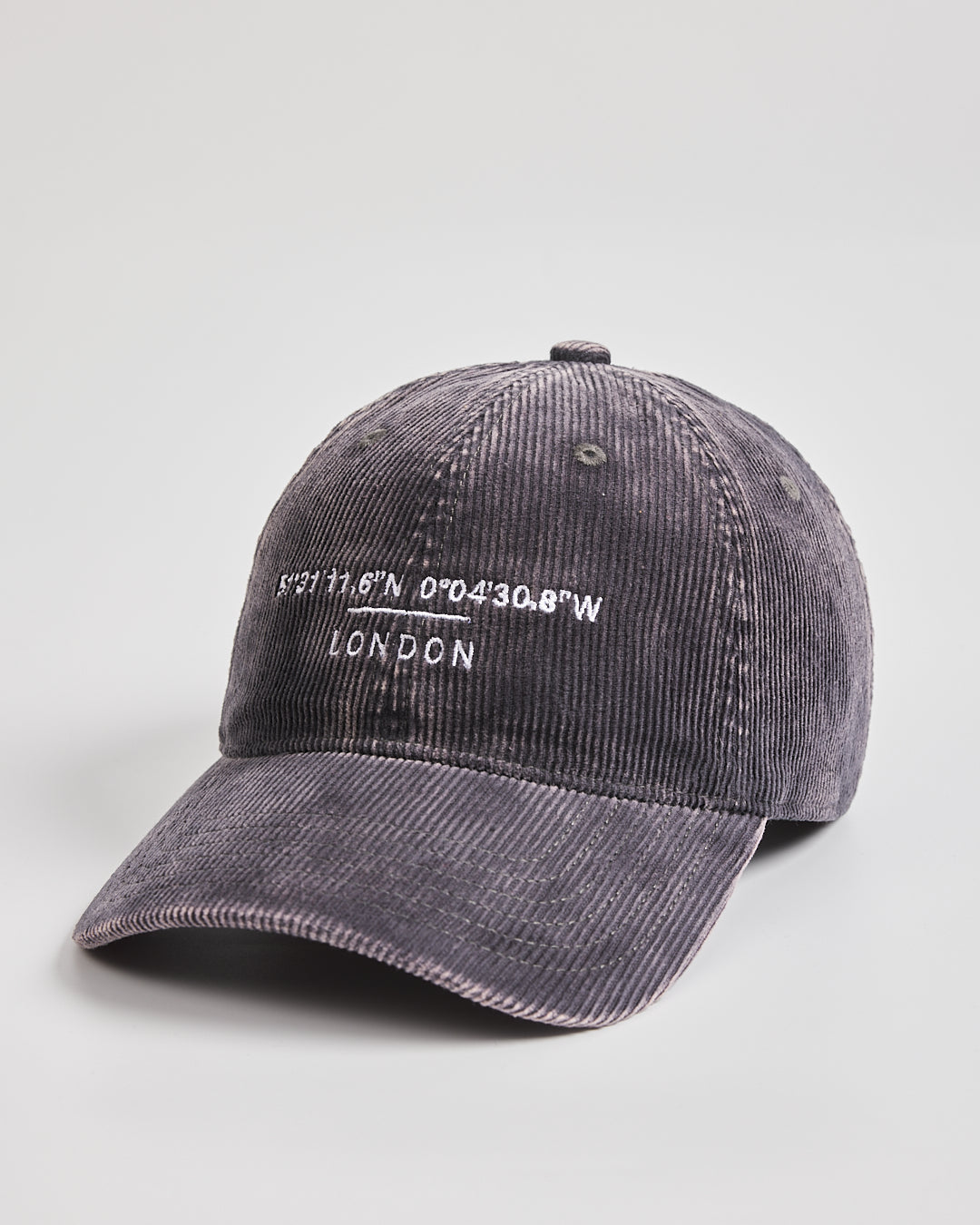 Gray corduroy cap with 'London' and coordinates on a light gray background