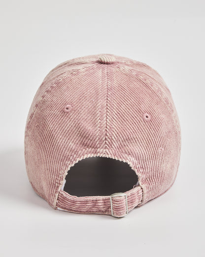 Pink corduroy cap on a light gray background