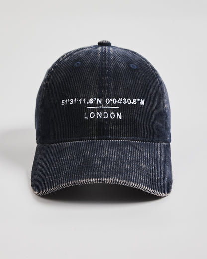 Navy cap with white text on a light gray background
