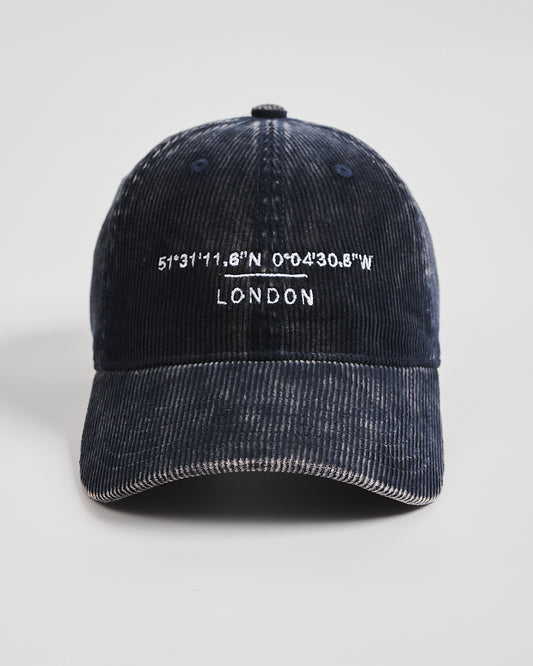 Navy cap with white text on a light gray background