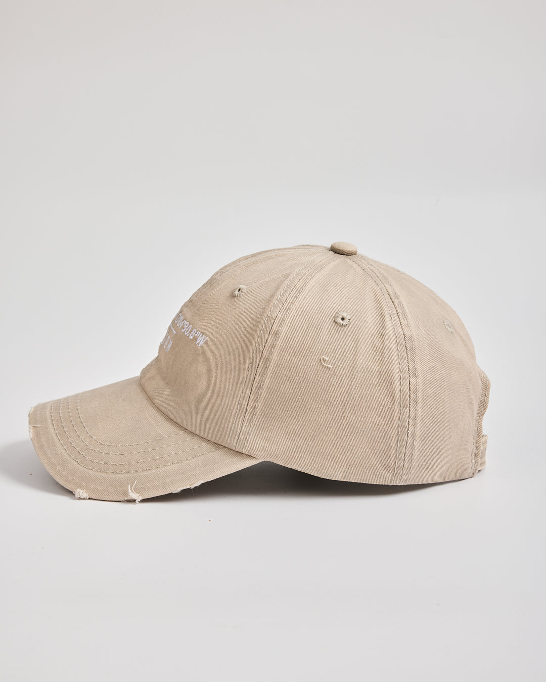 Beige baseball cap on a light gray background