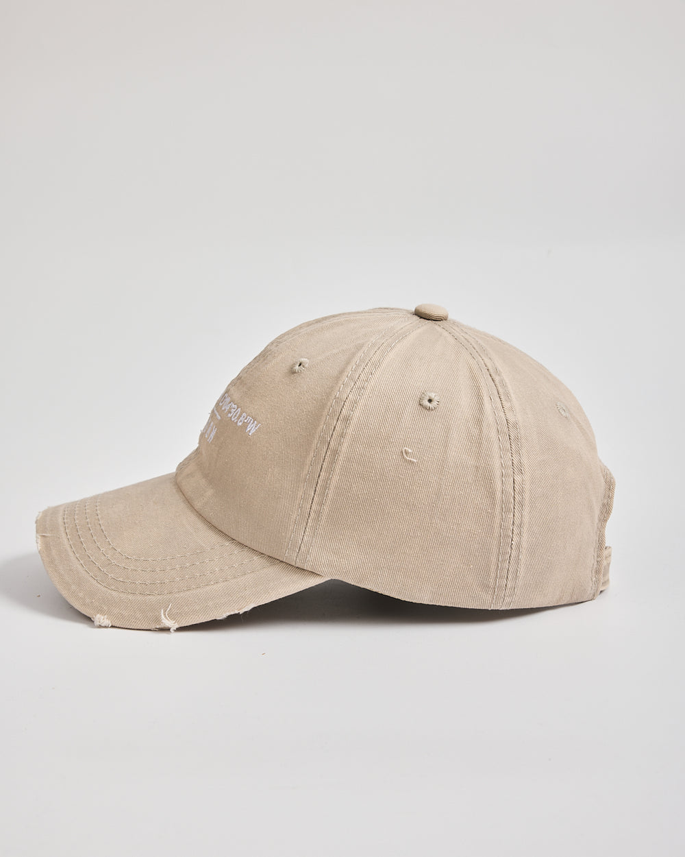 Beige baseball cap on a light gray background