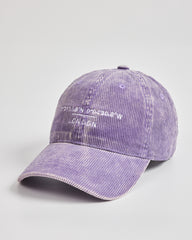 Purple corduroy cap with text on a light gray background