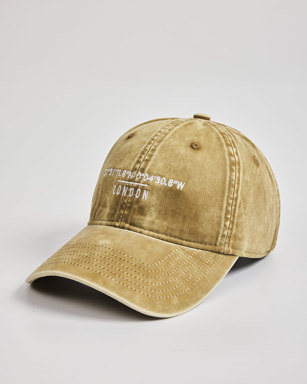 Yellow cap with text on a light gray background