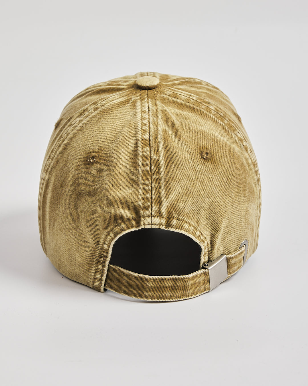 Yellow baseball cap on a light gray background