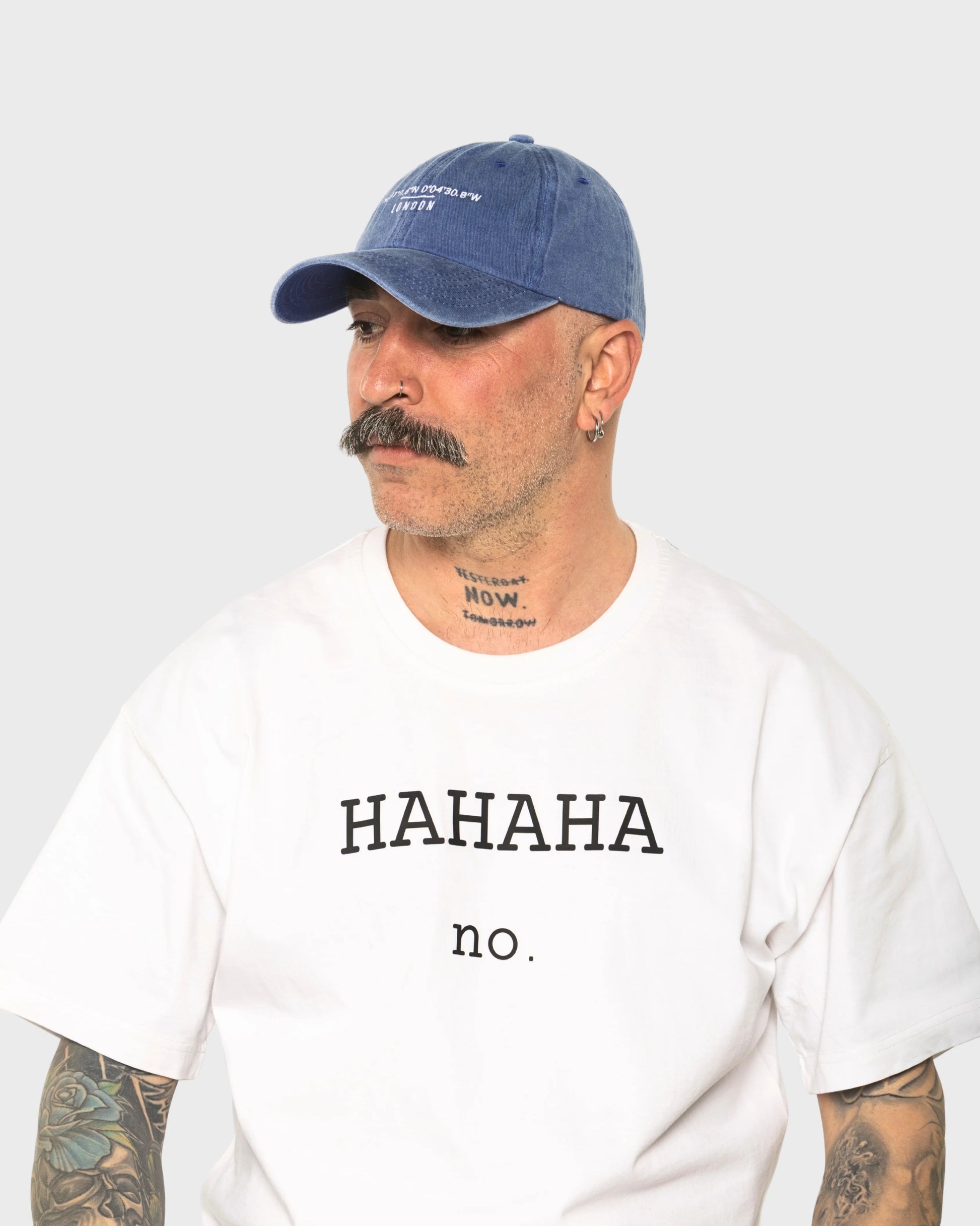 A man wearing the London Blue Washed Cap
