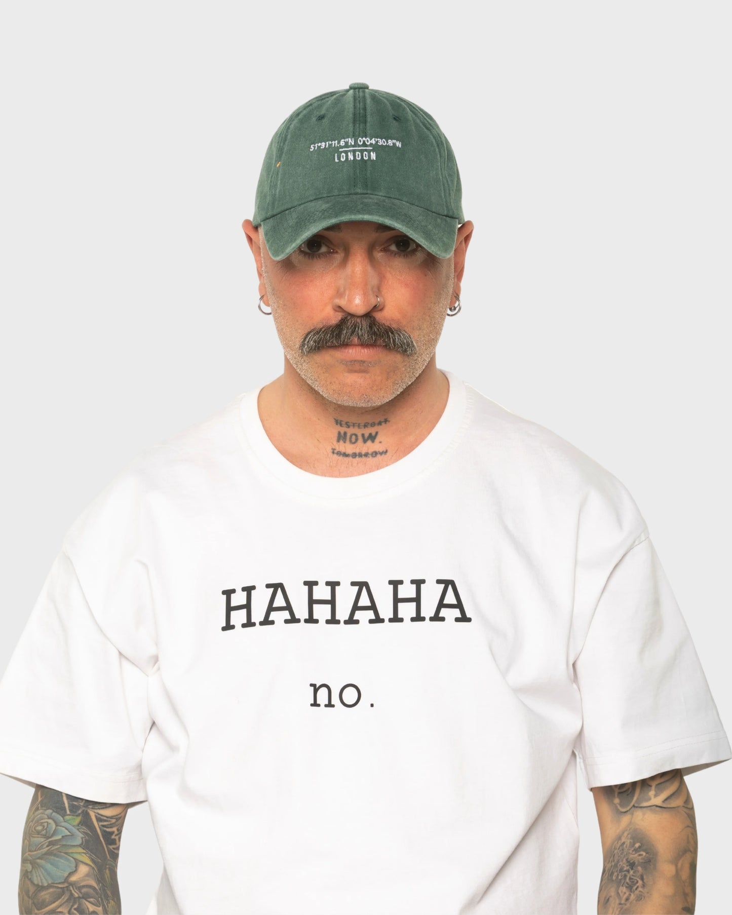 A man wearing the London Dark Green Washed Cap