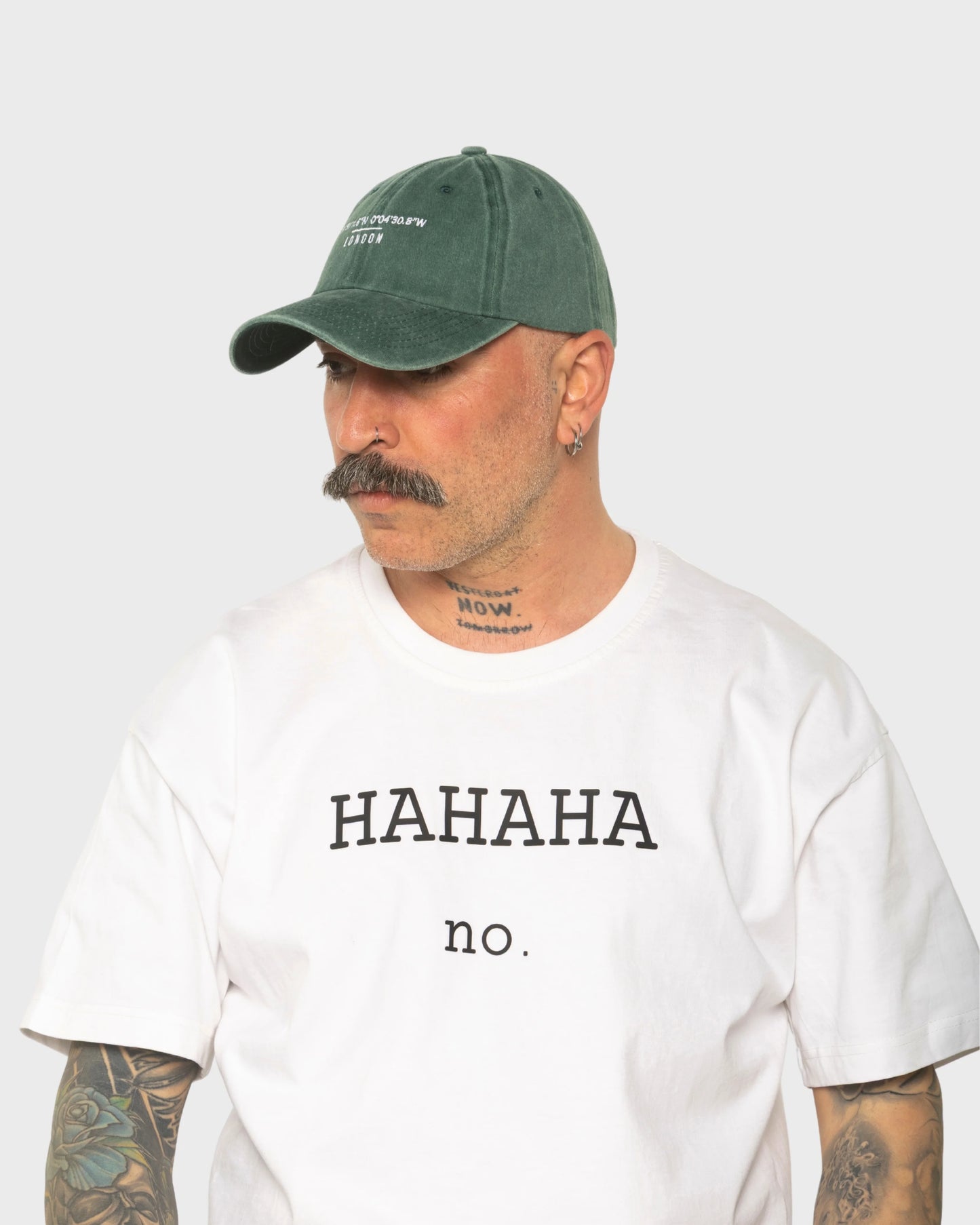A man wearing the London Dark Green Washed Cap