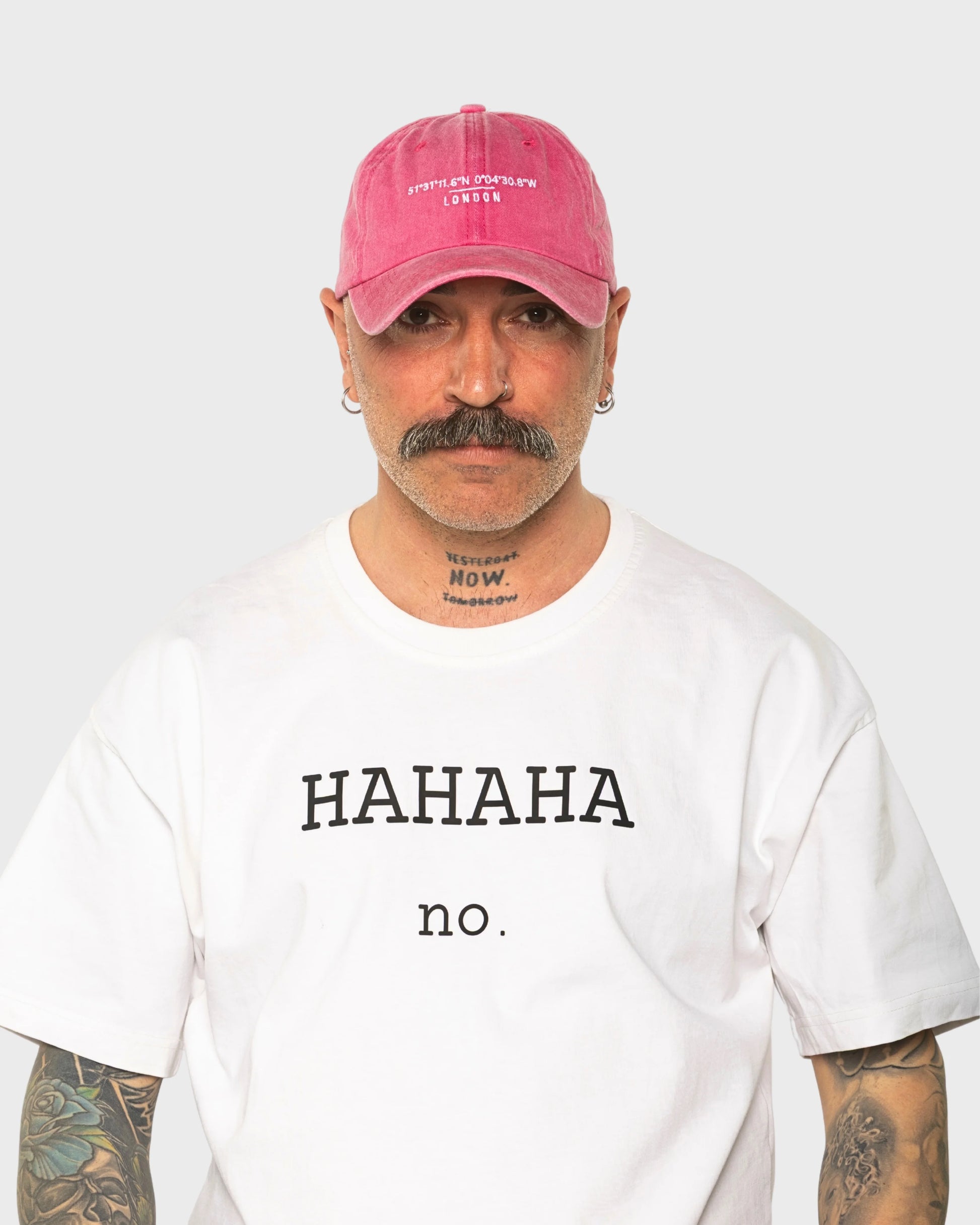 A man wearing the London Hot Pink Washed Cap