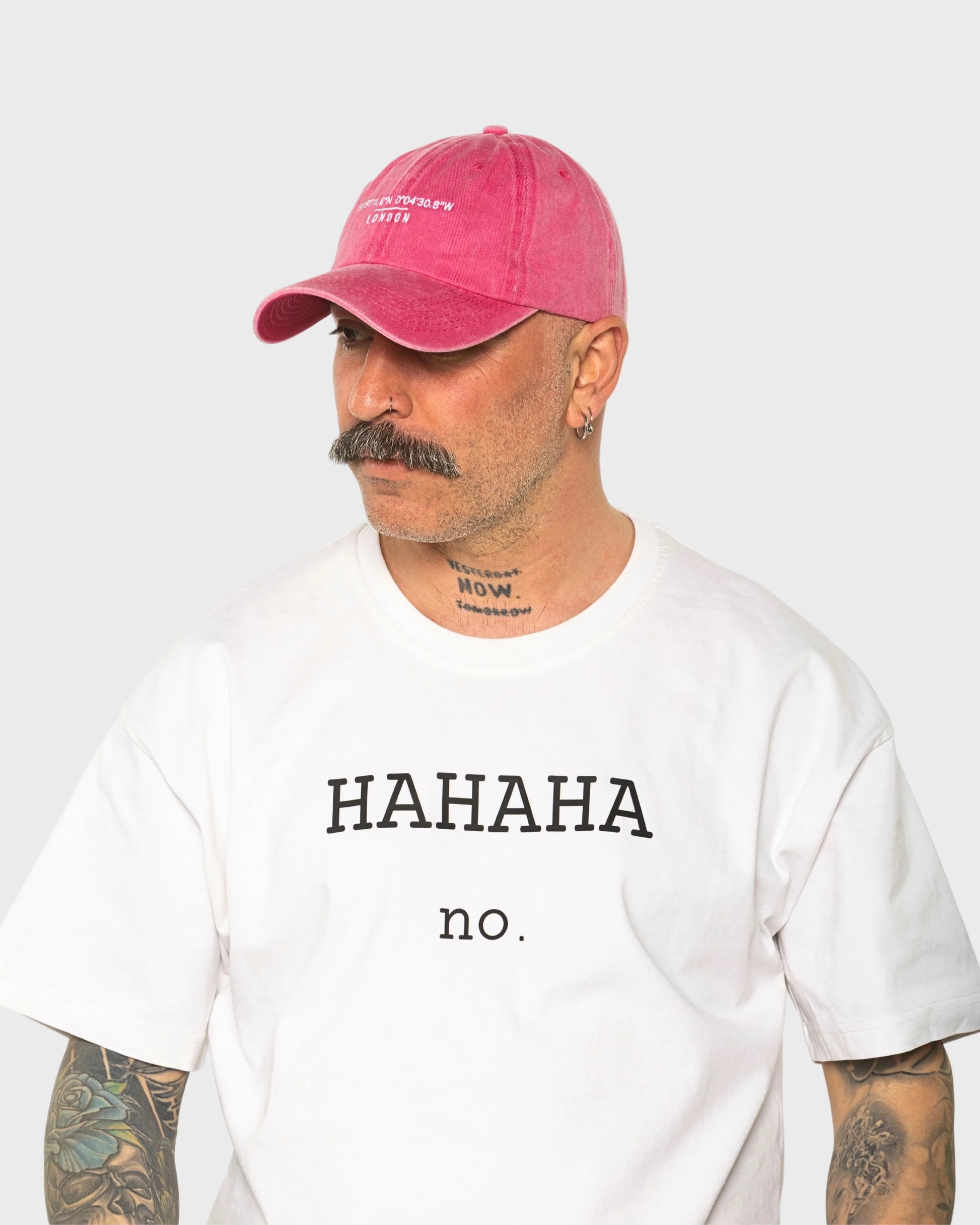 A man wearing the London Hot Pink Washed Cap