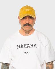 A man wearing the London Mustard Washed Cap