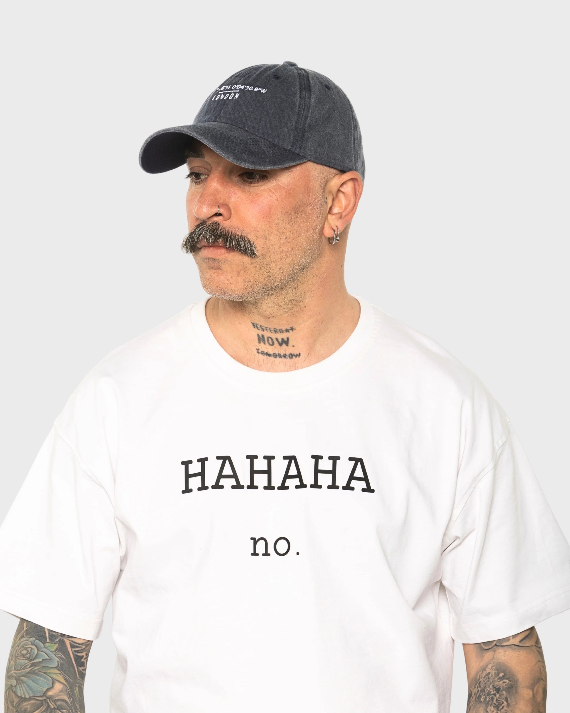 A man wearing the London Navy Washed Cap