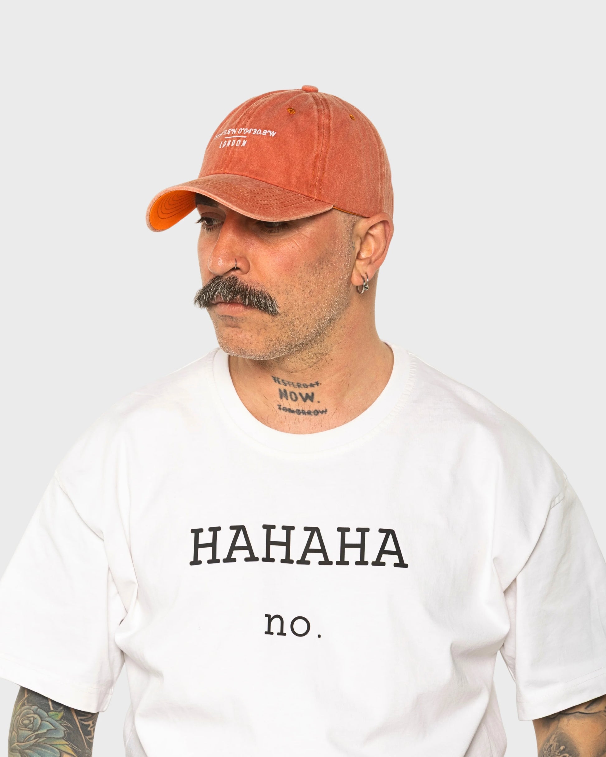 A man wearing the London Orange Washed Cap