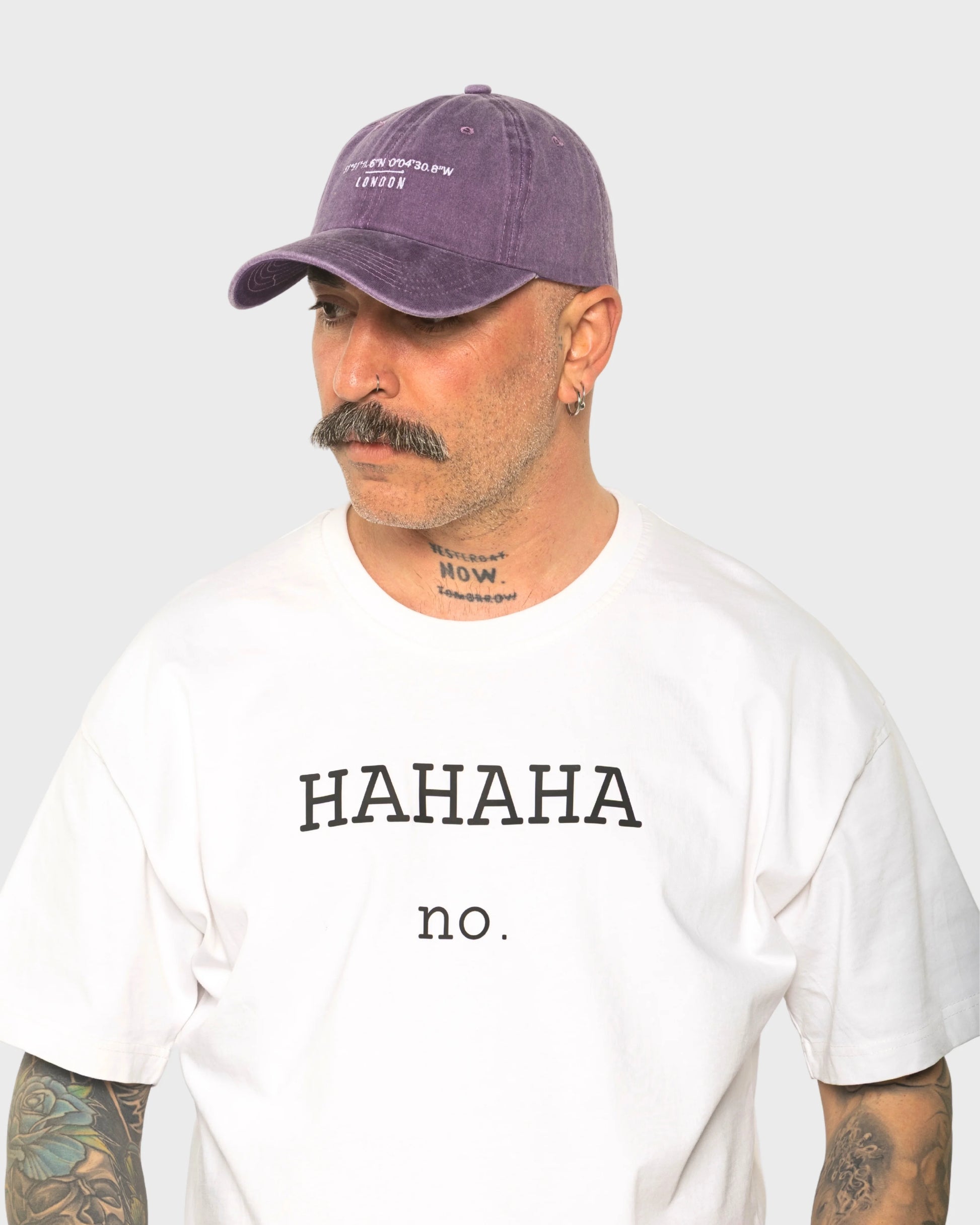 A man wearing the London Purple Washed Cap