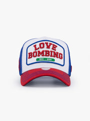 Front view of Love Bombing Blue Trucker Hat