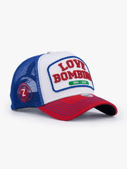 Side view of Love Bombing Blue Trucker Hat