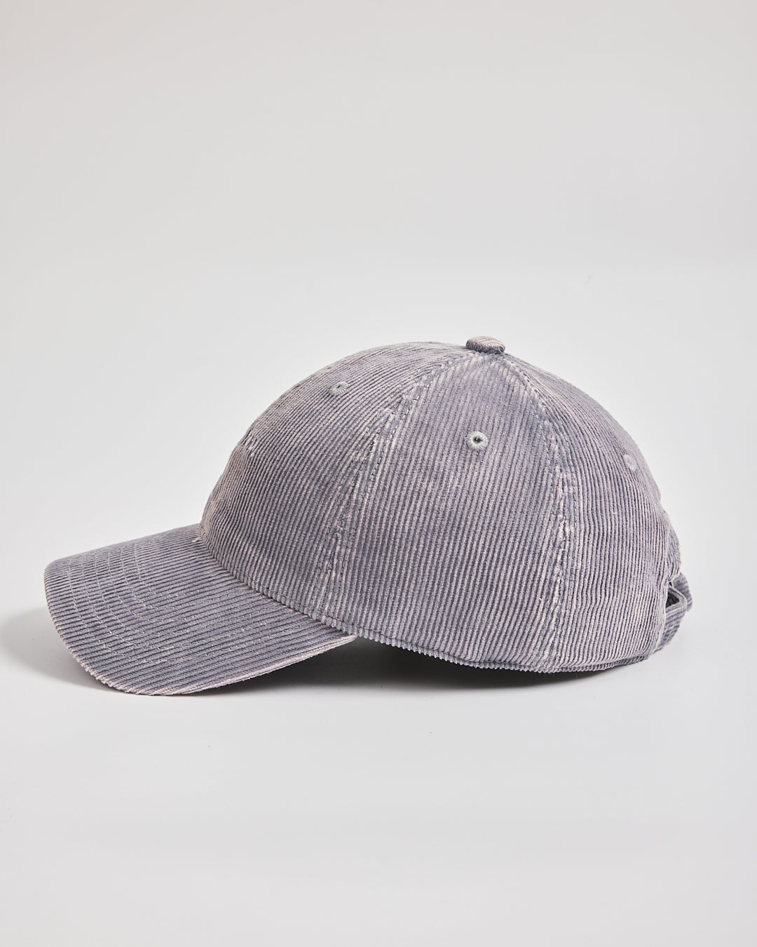Gray corduroy baseball cap on a light gray background