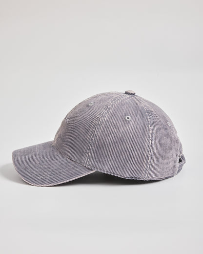 Gray corduroy baseball cap on a light gray background