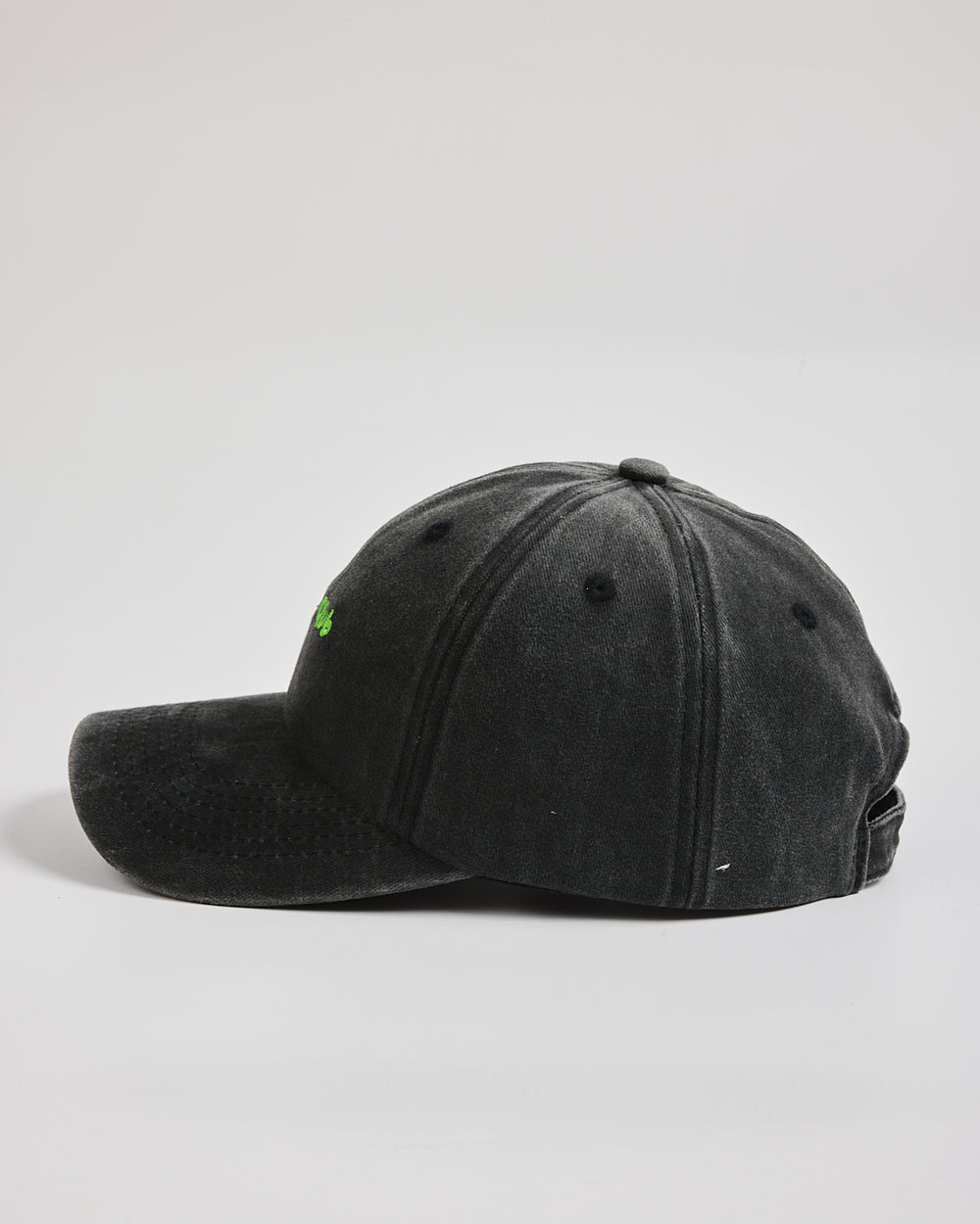Matcha Club Black Washed Caps on a light gray background