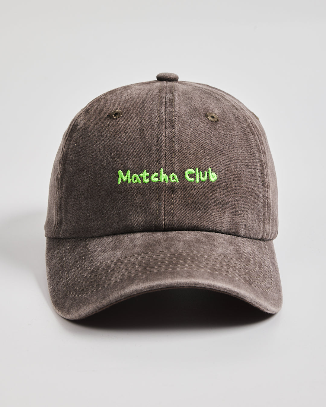 Front view of Matcha Club Brown Washed Caps