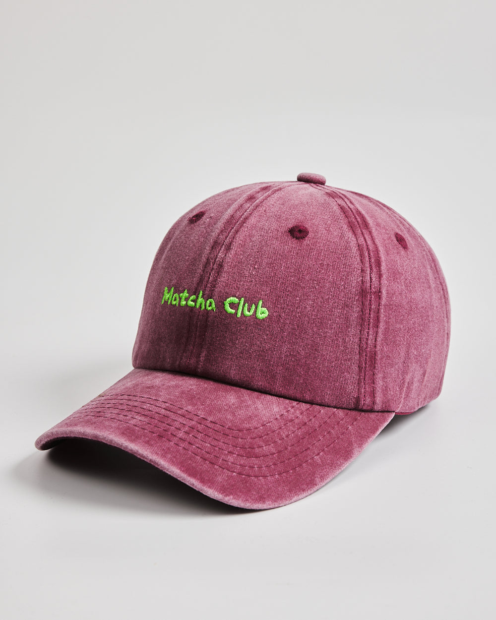 Side view of Matcha Club Burgundy Washed Caps