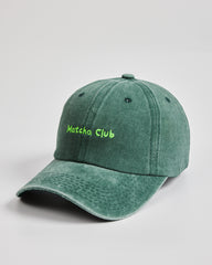 Side view of Matcha Club Dark Green Washed Cap