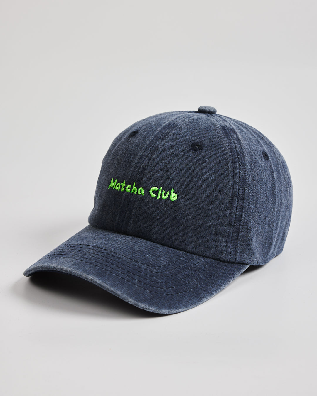 Side view of Matcha Club Navy Washed Caps