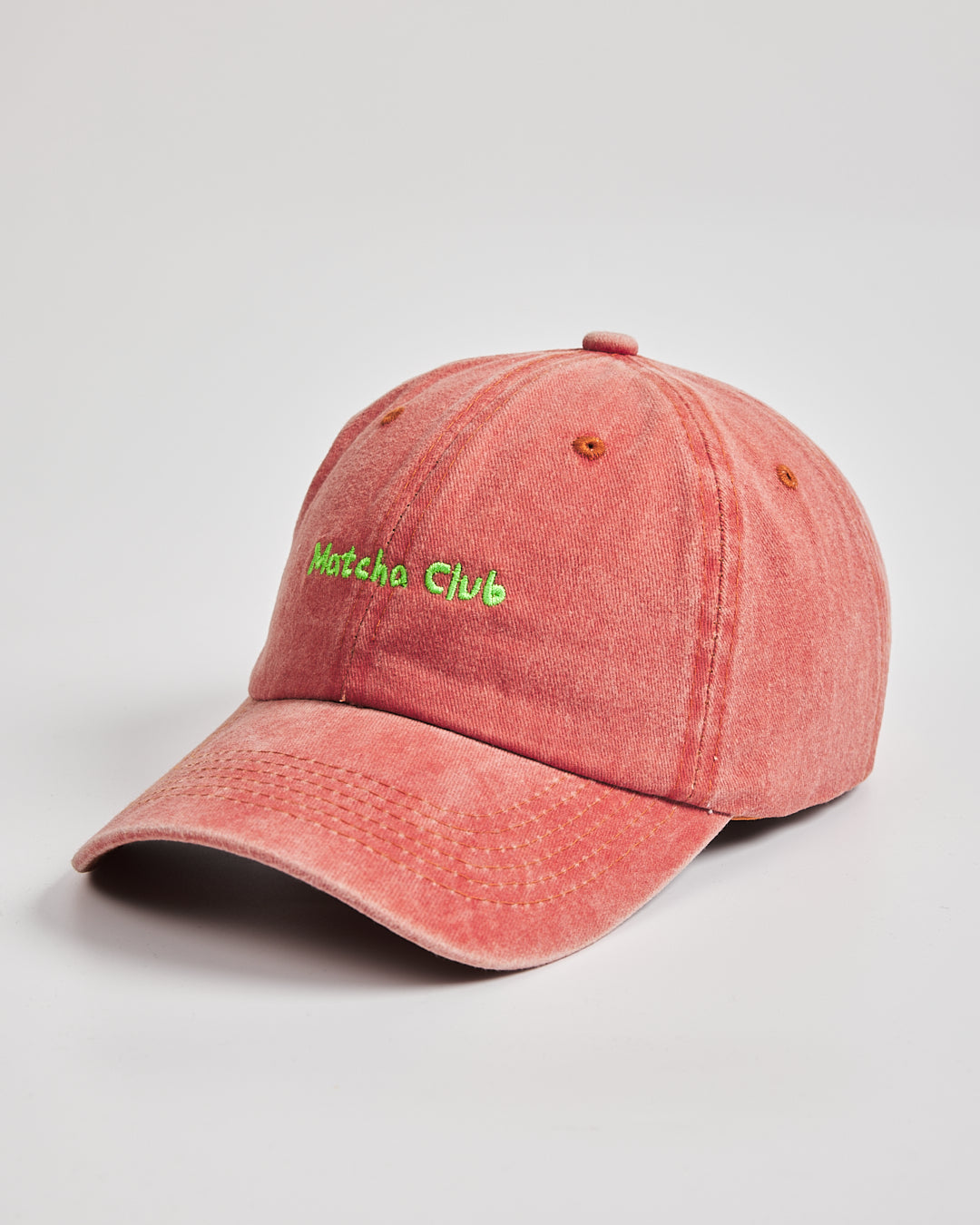 Side view of Matcha Club Orange Washed Cap