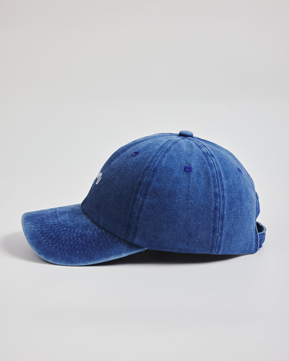 Mom Blue Washed Caps a light gray background