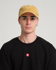 man wearing Mustard Hahaha No Washed Cap