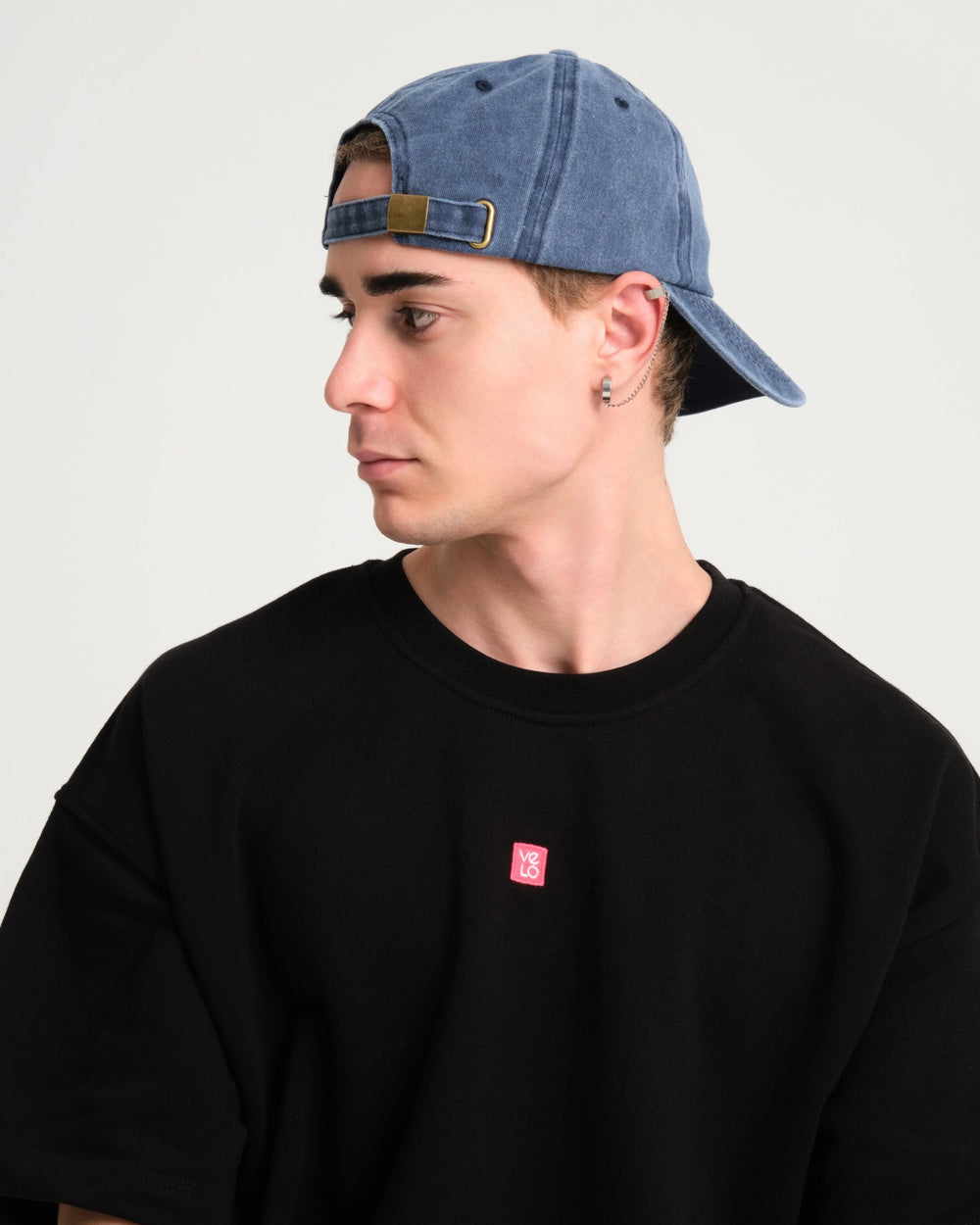 man wearing back of Navy Blue Washed Cap with Love You Bye embroidered in white